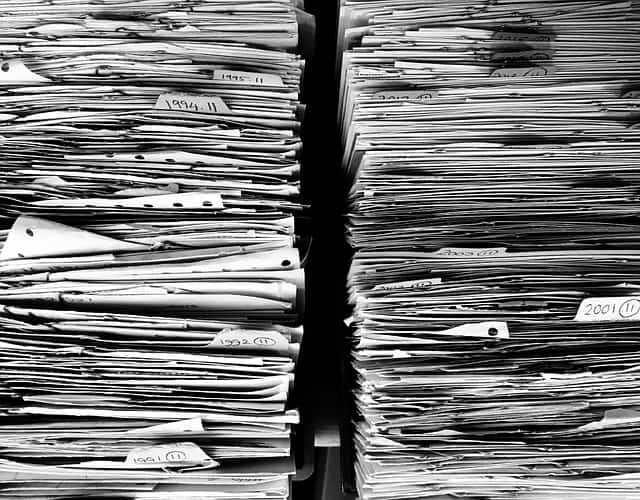 huge piles of office paper files