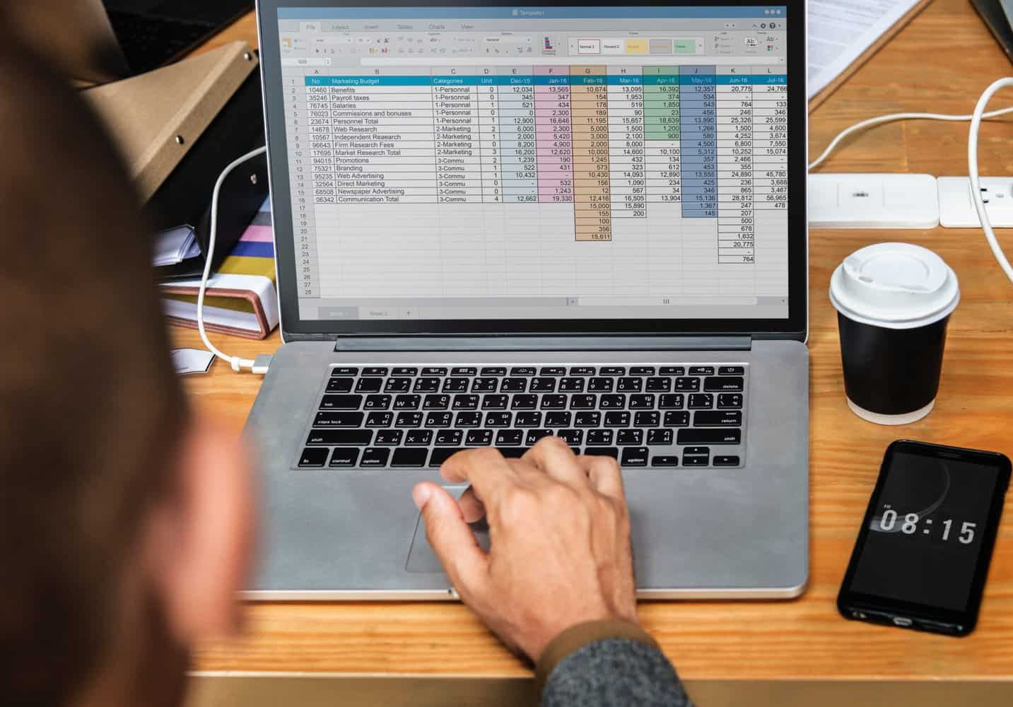 Woman is using microsoft excel to calculate something